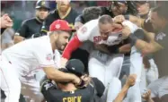  ?? GETTY IMAGES ?? The Reds’ Amir Garrett (50) started a brawl in the ninth inning Tuesday when he charged the Pirates’ dugout.