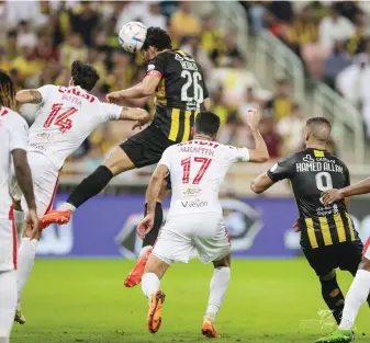  ?? Twitter: @ittihad ?? Ahmed Hegazi heads home Al-Ittihad’s dramatic late winner against Al-Wehda in the ROSHN Saudi League.