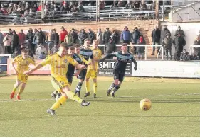  ??  ?? Spot on Craig Moore fires home the clinching penalty to sink Forfar