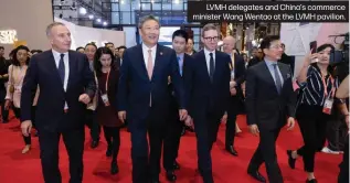  ?? ?? LVMH delegates and China's commerce minister Wang Wentao at the LVMH pavilion.