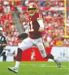  ?? Wil Vragovic / Gett y Images files ?? Washington’s Alex Smith has been cleared to play after a
leg fracture in 2018 that threatened his career.
