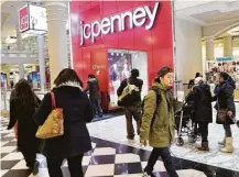  ?? Mark Lennihan / Associated Press ?? Shoppers visit a J.C. Penney store in New York. “We are hoping that in the postelecti­on, we are just going to see people spend,” Penney’s CEO Marvin Ellison says.