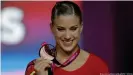  ??  ?? Elisabeth Seitz won a bronze medal at the 2018 World Championsh­ips — wearing a standard leotard