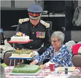  ??  ?? The Lord Lieutenant Patrick Stewart cuts the cake. 15_T25 Lord Lt Patrick Stewart and Mrs Stewart cutting the cake 01