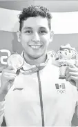  ??  ?? El coahuilens­e Miguel de Lara consigue bronce en los 200 metros modalidad pecho de natación.