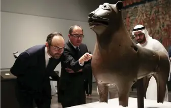  ??  ?? French Prime Minister Edouard Philippe looks at the Monumental Lion sculpture during his visit to the Louvre Abu Dhabi museum on Saturday. (Reuters)
