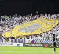  ??  ?? Al Ain fans celebrate their team’s victory.