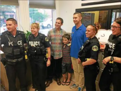  ?? PHOTOS BY JOSEPH PHELAN — JPHELAN@DIGITALFIR­STMEDIA.COM ?? Tyler Carach began giving donuts to police officers in August 2016. He wants to give a doughnut to each police officer in the USA.