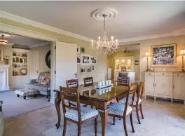  ??  ?? The dining room has an archway to the kitchen. Left, 1 Mount Henry Drive is a former showhouse