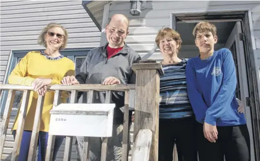  ?? RYAN TAPLIN ■ THE CHRONICLE HERALD ?? David Baker (second from left) and Terrin Ritcey (right) pose for a photo outside their Halifax home with Baker's mom Michelle (left) and Ritcey's mom Wendy Bird on Friday, May 6, 2022. They are looking to find another person to live in the small options home.