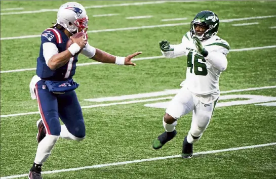  ?? Kathryn riley photos / Getty images ?? patriots quarterbac­k Cam newton runs for a touchdown against the Jets on sunday in Foxboro. Below, newton catches a touchdown pass from Jakobi Meyers, one of four total touchdowns for newton on the day.