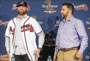  ?? ALYSSA POINTER/ALYSSA.POINTER@AJC.COM ?? Braves general manager Alex Anthopoulo­s (right) heads to the winter meetings this week already having added catcher Brian McCann (left) and third baseman Josh Donaldson.