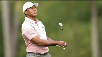  ?? AP photo ?? Tiger Woods watches his tee shot on the 12th hole during the first round of the Masters golf tournament at Augusta National Golf Club on Thursday in Augusta, Ga.