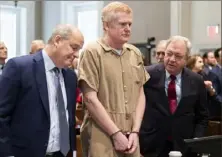 ?? Joshua Boucher/The State via AP ?? Alex Murdaugh speaks with his legal team before he is sentenced to two consecutiv­e life sentences for the murder of his wife and son in March. Murdaugh’s lawyers want a new trial, accusing the court clerk of improperly influencin­g the jury.