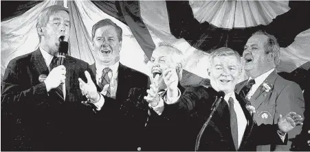  ??  ?? LIVE FROM HALITOSIS HALL: An annual highlight of then-Senate President William Bulger’s St. Patrick’s Day breakfasts was a song by Crane, seen at center in 1995 with Gov. William Weld, left, and Bulger, second from right.