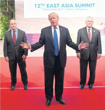  ?? AFP ?? US President Donald Trump gestures to the press as US National Security Adviser HR McMaster, left, and US Secretary of State Rex Tillerson look on after attending the 31st Associatio­n of Southeast Asian Nations Summit in Manila on Tuesday.