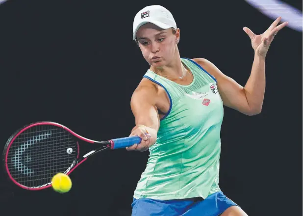  ?? Picture: AAP ?? FIGHTING SPIRIT: Ashleigh Barty, of Australia, plays a forehand shot during her 5-7, 6-1, 6-1 first round win over Lesia Tsurenko, of Ukraine, at the Australian Open at Rod Laver Arena in Melbourne on Monday, Barty will next play Slovenia’s Polona Hercog.