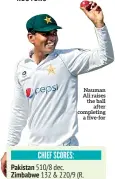  ??  ?? Nauman Ali raises the ball after completing a five-for