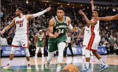  ?? Jeffrey Phelps / Associated Press ?? Milwaukee forward Giannis Antetokoun­mpo and the Bucks lost to Miami in the playoffs this season as the No. 1 seed. Now the franchise must make some hard choices.