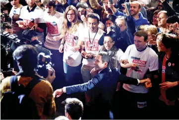  ??  ?? Hamon arrives at a campaign rally in Paris. — Reuters photo