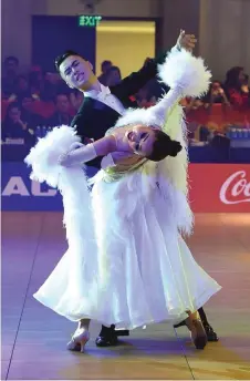  ?? — AFP photo ?? Vietnam’s Vu Hoange Anh Minh (le ) and Nguyen Truong Xuan (right) perform during the dancesport event in the SEA Games (Southeast Asian Games) in Clark, Capas town, Tarlac province north of Manila.