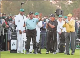  ?? Ap-curtis Compton ?? Elder gestures as he is introduced and applauded by honorary starters Gary Player and Jack Nicklaus, right, before the ceremonial tee shots to begin the Masters.