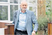  ??  ?? Jeremy Corbyn leaving his home in London yesterday. He said of his attendance at the ceremony: “I was there because I wanted to see a fitting memorial to everyone who’s died in every terrorist incident everywhere, because you have to end it.”