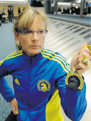  ?? MARK VAN MANEN/ PNG ?? Boston Marathon runner Karyn Mitchell is relieved to be back home safely in Vancouver after arriving late Tuesday night at YVR. Mitchell is also planning to run in Sunday’s Sun Run.