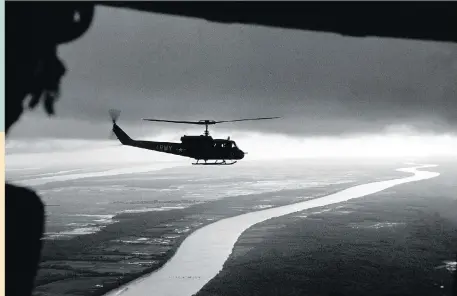  ?? RENE BURRI/MAGNUM PHOTOS/PBS ?? South Vietnamese troops fly over the Mekong Delta in 1963.