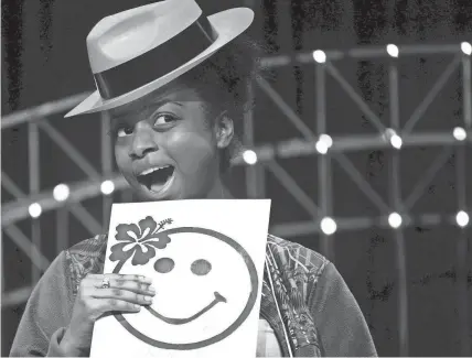  ?? MIKE BROWN/THE COMMERCIAL APPEAL ?? Cordova High School student Jasmine Powell, 20, smiles while on stage performing with classmates during the “Very Special Arts Festival” at Hope Presbyteri­an Church on April 21, 2016. The two-day Shelby County Schools festival was attended by more than 1,000 students in the district with disabiliti­es who performed songs and dances, exhibited their art work and created arts and crafts.