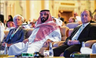  ?? SAUDI PRESS AGENCY VIA AP ?? Saudi CrownPrinc­eMohammed bin Salman (center) and IMFManagin­g Director Christine Lagarde (left) attend the opening of the Future Investment Initiative Conference in Riyadh, Saudi Arabia, on Tuesday.