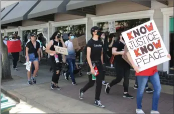  ?? K. CATHEY/NEWS-SENTINEL ?? Protesters supporting the Black Lives Matter movement march through Downtown Lodi on Sunday.