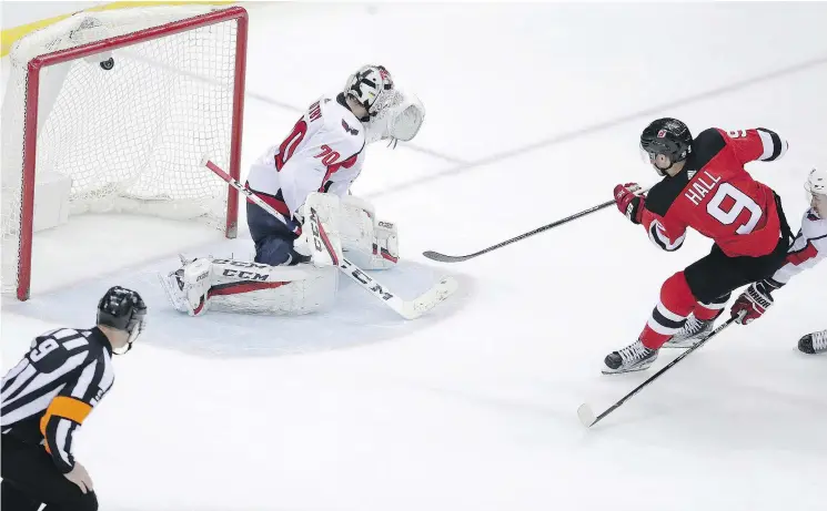  ?? — AP FILES ?? Devils winger Taylor Hall scores the winner on Capitals goalie Braden Holtby in overtime, when a single mistake can cost your team a point in the standings.