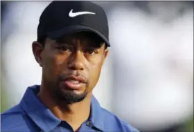  ?? KAMRAN JEBREILI - THE ASSOCIATED PRESS ?? In this Feb. 2, 2017, file photo, Tiger Woods reacts on the 10th hole during the first round of the Dubai Desert Classic golf tournament in Dubai, United Arab Emirates. Tiger Woods had the active ingredient for marijuana, two painkiller­s and two sleep...
