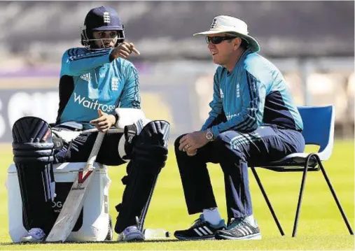  ??  ?? NETS SESSION: England’s Adil Rashid, left, and head coach Trevor Bayliss take a break