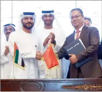  ?? — Supplied photo ?? Captain Mohamed Juma Al Shamisi and Zhang Wei signed the agreement in Abu Dhabi on Wednesday.