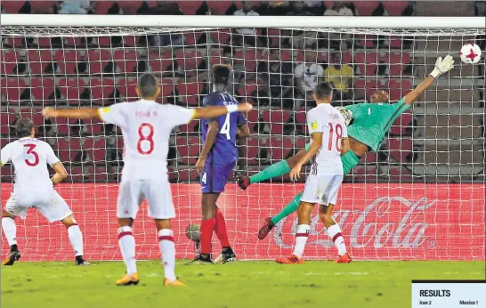  ??  ?? France goalkeeper Yahia Fofana fails to stop Juan Miranda’s (left) shot in their FIFA U17 World Cup prequarter­s match in Guwahati. Spain progressed with a 21 win.