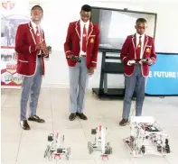  ?? ?? Tynwald High School robotics team programmer, Tanatswa Taremba (right) with teammates, Daryl Mubvuma (left) and Shelton Chinoona explain about the robotic prototypes during the STEAM tour of the School’s robotics department in Harare yesterday