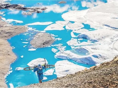  ?? ?? Darren Berrecloth rode mountain bike trails among glaciers in the Arctic Circle while filming North of Nightfall.