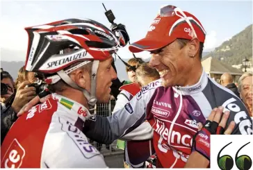  ??  ?? Lloyd congratula­tes Philippe Gilbert after the Belgian won Lombardia in 2009