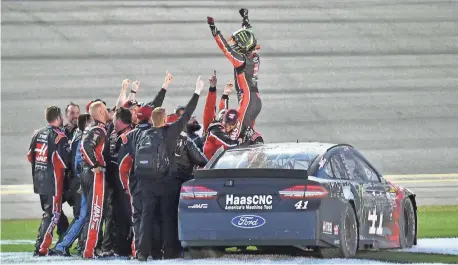  ?? JASEN VINLOVE, USA TODAY SPORTS ?? Kurt Busch celebrates after prevailing in Sunday’s Daytona 500, his first victory in NASCAR’s marquee race.