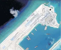  ??  ?? A satellite image obtained by Reuters in April this year shows airstrip constructi­on on Fiery Cross Reef in the South China Sea.