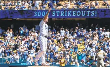  ?? MAX SCHERZER Robert Gauthier Los Angeles Times ?? takes a moment to salute the crowd after recording the 3,000th strikeout of his career.