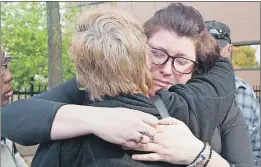  ?? CP PHOTO ?? Rebecca Blight (right) embraces family friend Kathy Mitchell, president of MADD York Region, after Marco Muzzo, the accused in an impaired-driving case in which a man and his three grandchild­ren were killed, appeared at his court hearing at the...