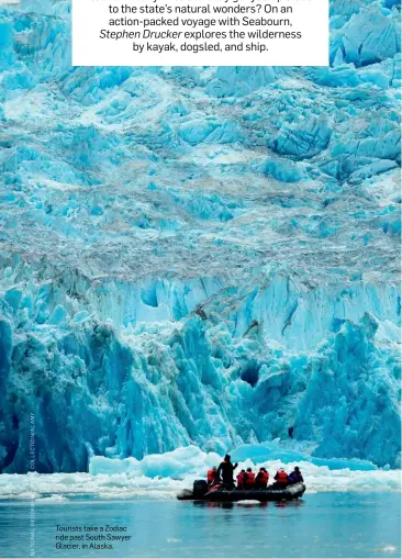  ??  ?? Tourists take a Zodiac ride past South Sawyer Glacier, in Alaska.