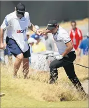  ?? Ted S. Warren
Associated Press ?? JASON DAY IS HELPED