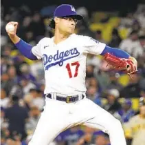  ?? MARK J. TERRILL AP ?? Dodgers re-signed relief pitcher Joe Kelly, who’s giving up his jersey No. 17, to a one-year contract worth $8 million.