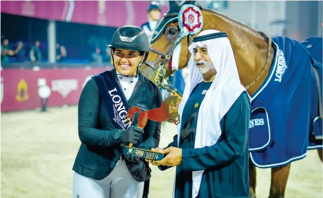  ??  ?? ↑
Sheikh Nahyan gives the trophy to Sara Hussein Saleh Al Armouti.