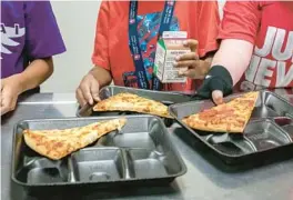  ?? ALBERTO MARIANI/AP 2022 ?? U.S. agricultur­e officials proposed new nutrition standards for school meals, including limits on added sugars and sodium. Reactions to the plan are mixed.