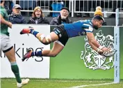  ??  ?? Back in style: England wing Joe Cokanasiga dives over the line to score Bath’s second try in their win against Newcastle